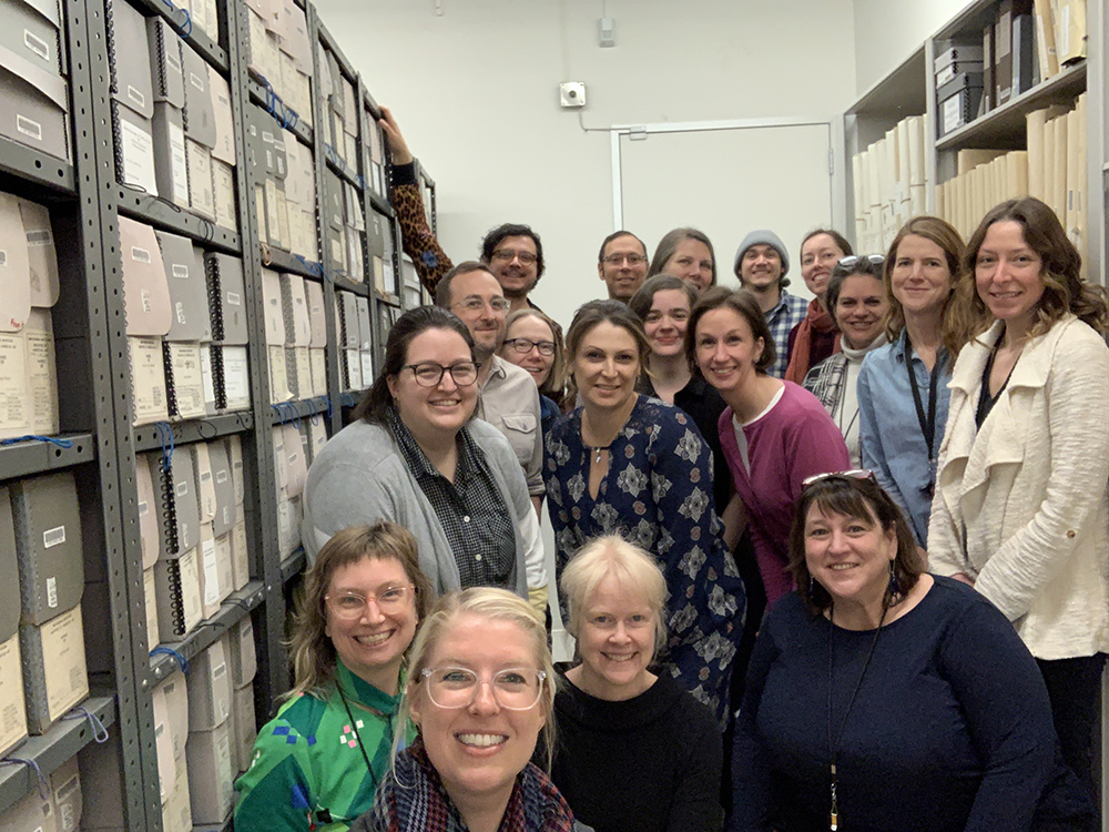 Photograph of the Archives' staff in our storage room