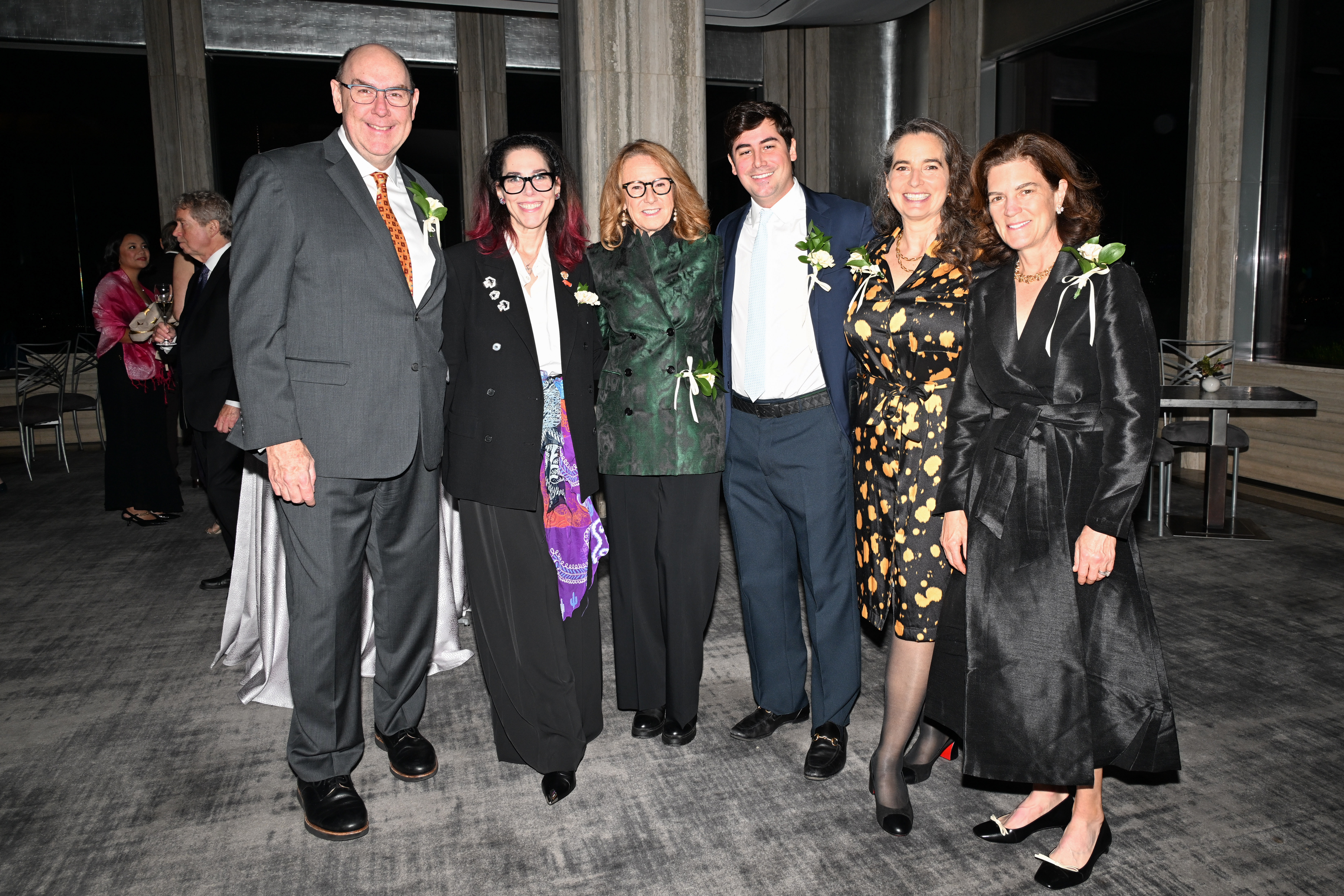 Trustee Michael Stubblefield, gala co-chair Amanda Quinn Olivar, honoree Ann Philbin, gala co-chair George Frederick Mead Merck, trustee Alexandra May, and trustee Laura Whitman pose for a photograph during cocktail hour.