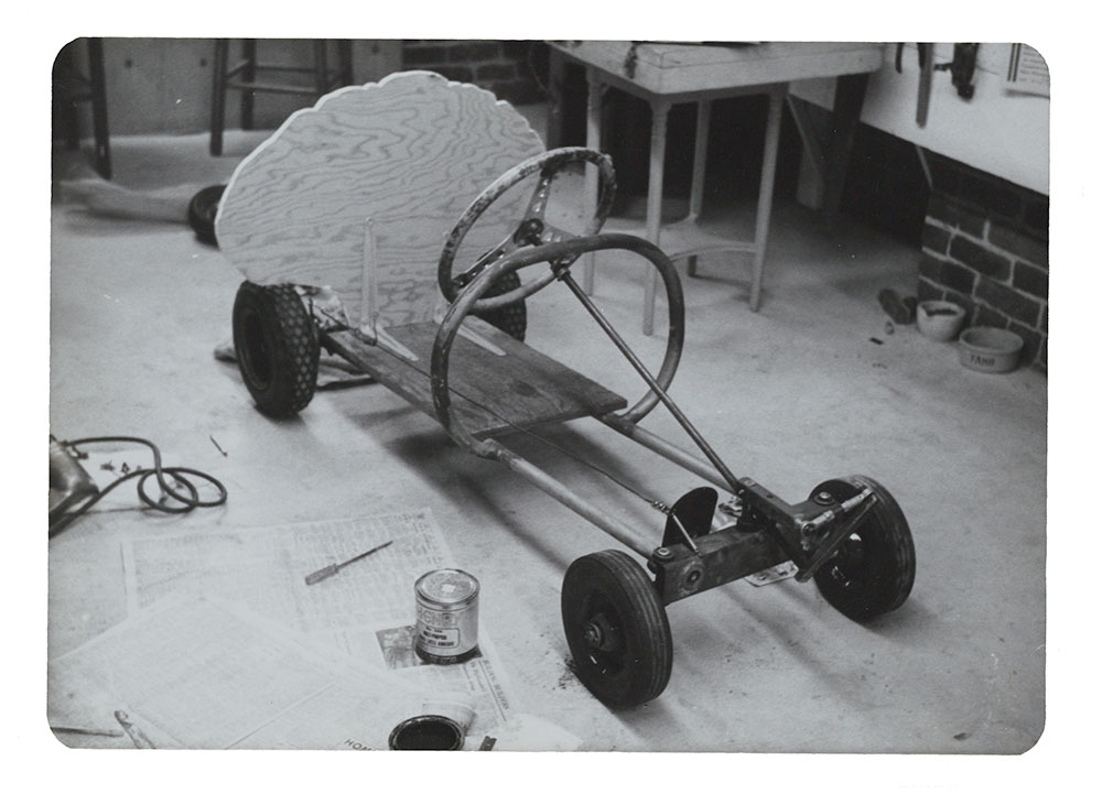 Photograph of basic structure of Tongue-tied Artists' Soap Box Derby car by Eleanor Dickinson, 1975 / unidentified photographer. Eleanor Dickinson papers, 1951-2003. Archives of American Art, Smithsonian Institution. Image of Eleanor Dickinson's Artists' Soap Box Derby Car's basic structure