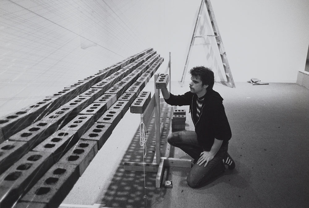 Loren Madsen installing a sculpture at the Hirshhorn