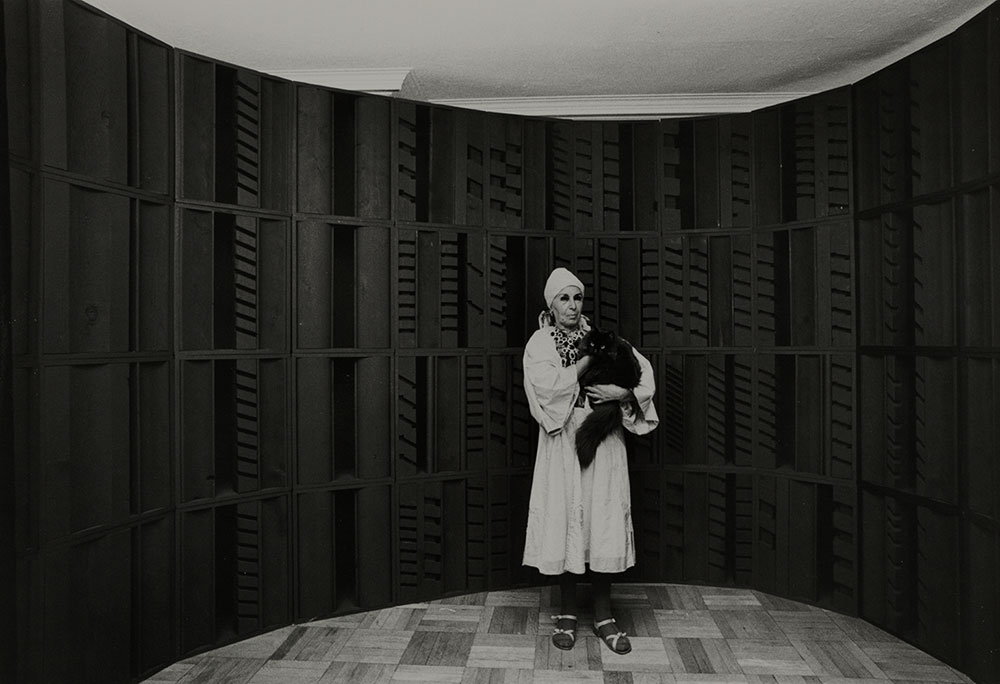 Photograph of Louise Nevelson with a black cat