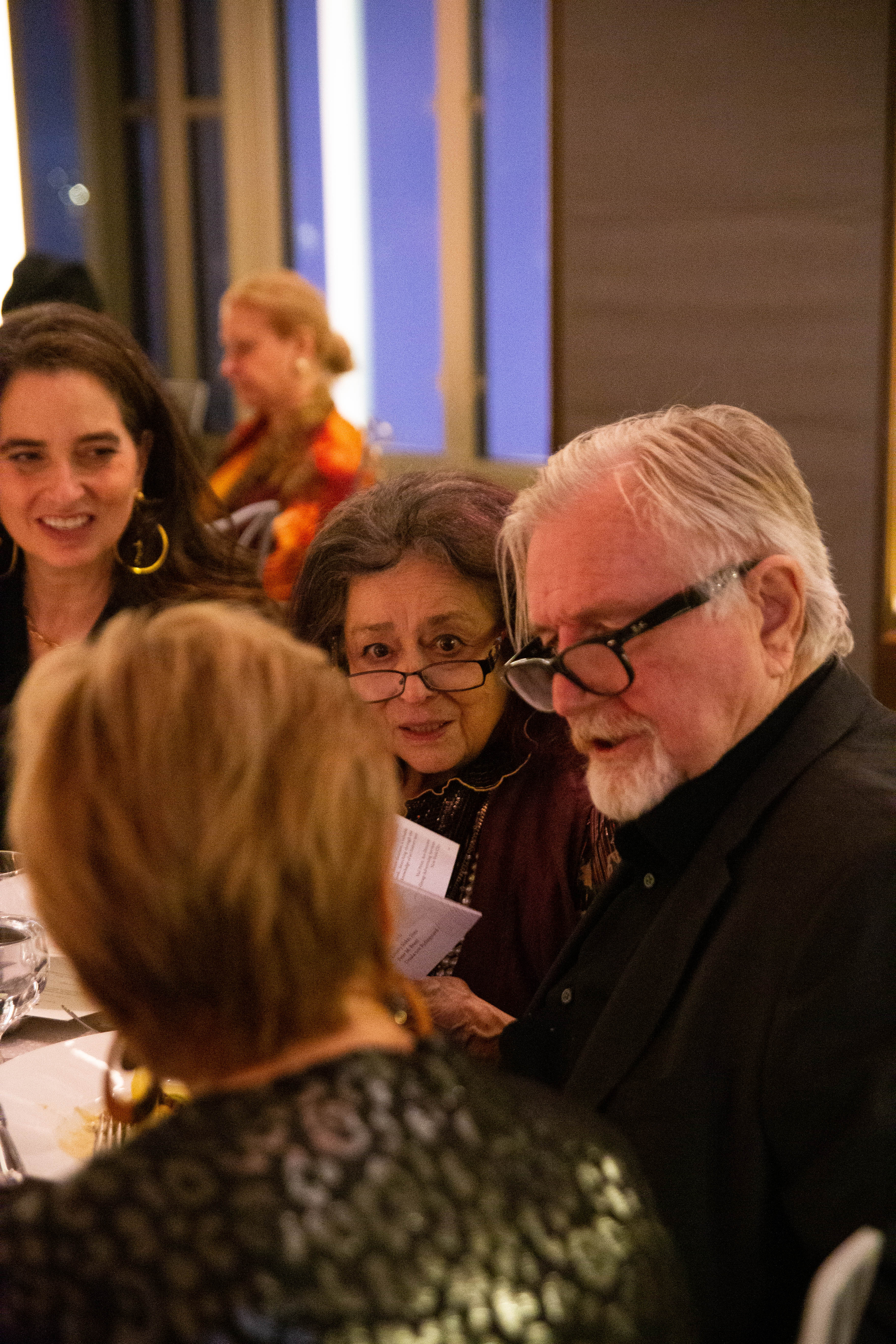 Alexandra May, Joan Agajanian Quinn, Laddie John Dill, and Bonnie Larson enjoy conversation during the dinner and awards presentation.