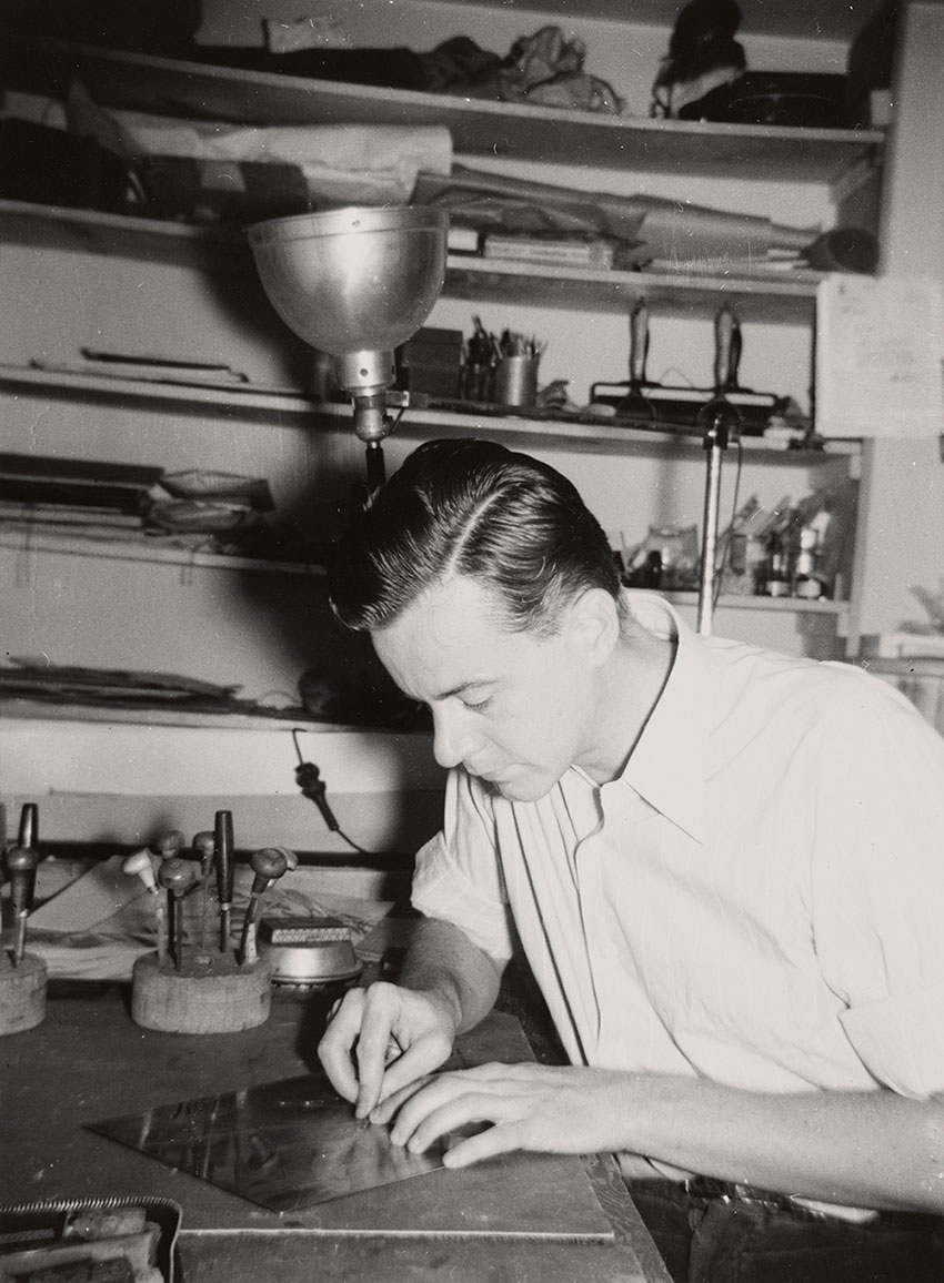 Photograph of Fred Becker creating an etching plate at Atelier 17 in New York City, 194- / unidentified photographer. Fred Becker papers, 1913-2004, bulk 1940-2000. Archives of American Art, Smithsonian Institution. Fred Becker pictured in his studio