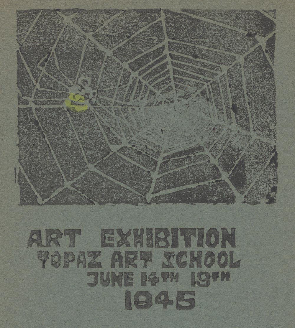 Detail of catalog for an art exhibition at the Topaz Art School, at the Topaz Relocation Center where people of Japanese descent were incarcerated during WWII. The catalog is green, but faded and stamped with a print of a spider in a web and the text: Art Exhibition / Topaz Art School / June 14th to 19th / 1945.