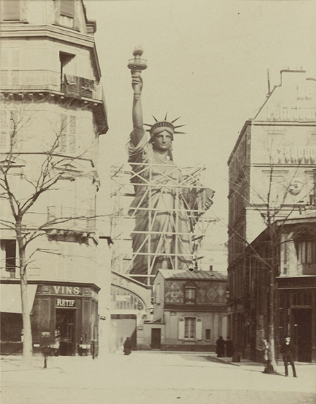 Alber Fernique (1841–1898), 'LA LIBERTÉ ÉCLAIRANT LE MONDE' albumen print, mounted to stiff red-bordered card, titled and dated in ink on the mount, framed, 1883 6 1/2 by 4 3/4 in. (16 by 12 cm.). Photograph Courtesy of Sotheby’s, Inc. © 2010 Photograph of the Statue of Liberty being constructed outside the studio of Frédéric Auguste Bartholdi taken by Alber Fernique