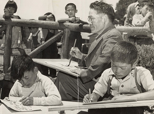 Chiura Obata leading an art class for incarcerated children