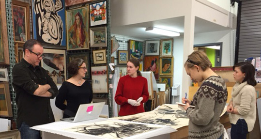The authors examining  drawings by Dorothy Strum with Dr. Joe Lucchesi and Dr. Kelly Quinn at St. Mary's College of Maryland. 