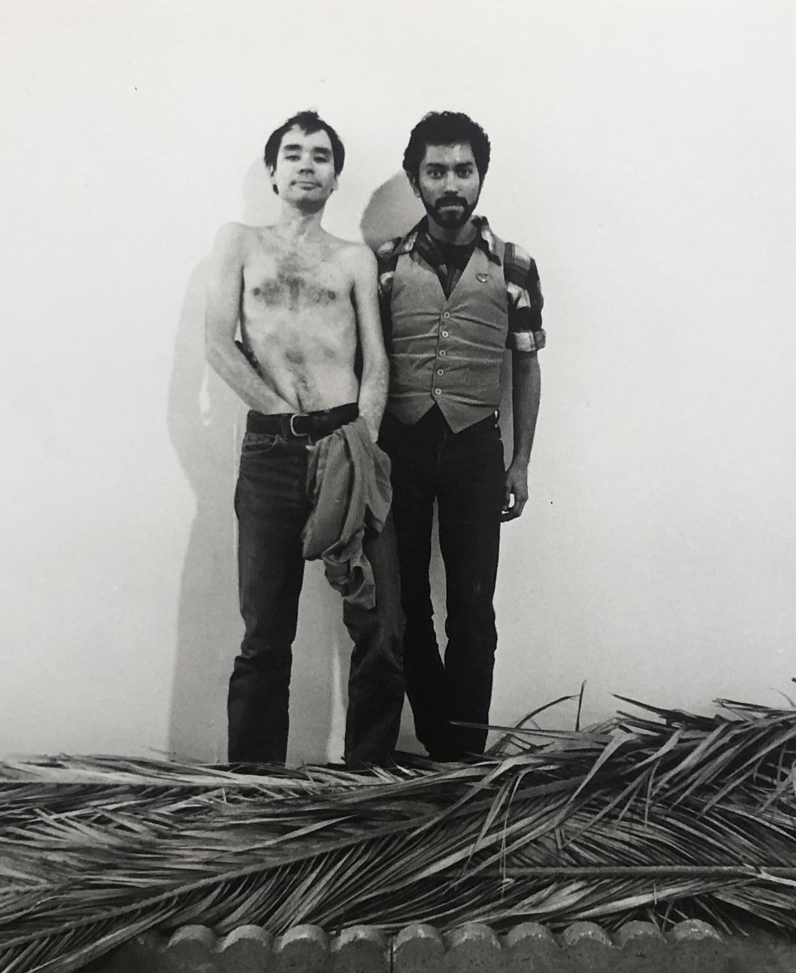 Photograph of Jerry Dreva and Gronk standing on top of leaves