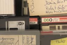 Detail of a selection of cassette tapes and other audio media.
