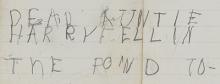 Detail of letter written in pencil and printed text by a child on blue-lined paper.