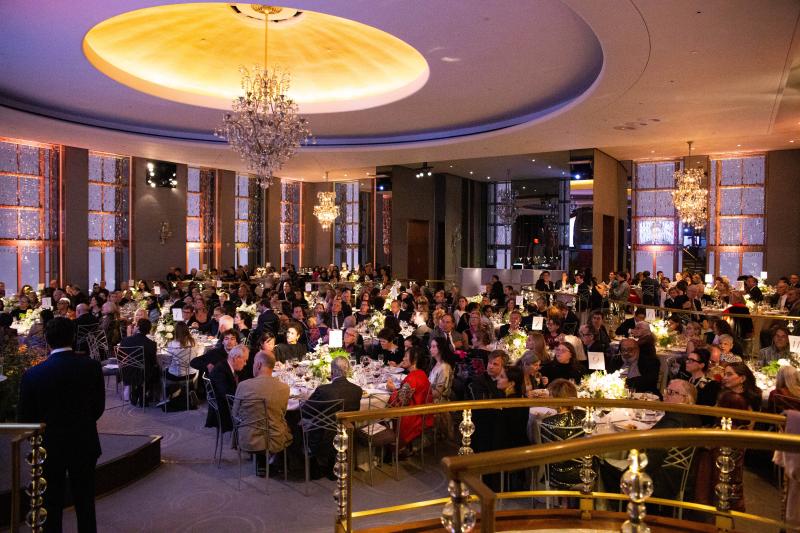 Photograph of attendees of the Gala seated at tables in a large event room