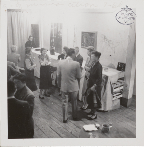 Figure 25. 14 Painter-Printmakers party, November 1954. Identifiable figures are: Seong Moy (lower left corner), Alice Trumbull Mason (at center, standing in front of chair), and Minna Citron (at far right). 14 Painter-Printmakers party, unidentified photographer. Minna Wright Citron papers, Archives of American Art, Smithsonian Institution.